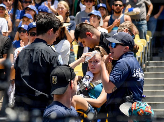 Every year, fans are forced to make trips to the hospital after being injured by a foul ball; this fan was taken out of Dodger Stadium on a stretcher in 2019.